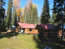 Log guest cabins at Steelhead Valhalla Lodge