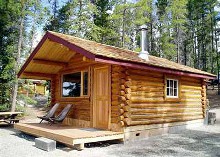 Log guest cabin at Stewart's Lodge & Camps