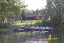 Fishing boats and cabins at Kenanow Lodge