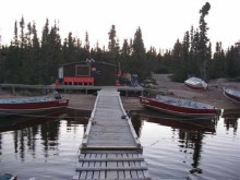 Boat docks and guest cabin at Munroe lake Lodge