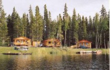 Outpost cabins viewed from lake at Neso Lake Adventures