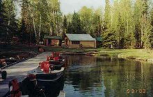 Boat dock and cabin at Pine Point Lodge
