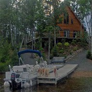 Boat dock and cabin at Silver Cross Fishing Lodge