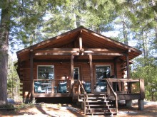 Rustic guest cabin at Antler's Kingfisher Lodge