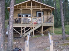 Guest cabin with deck at Austin's Wilderness Fishing Lodge
