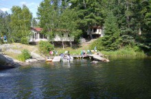 Guest cabin and lakeshore at Camp Waterfall