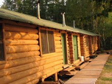 log cabins for guests at Cat Island Lodge