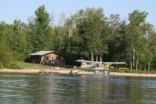 Outpost cabin and float plane by Hearst Air Service
