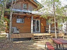 Guest cabin with picnic table at Highwind Lake Camp