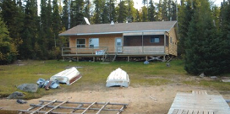 Guest cabin with dock at Knobby's Fly-In Lodge & Outposts