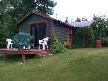 Guest cabin with grill at Larsson's Camp