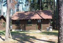 Log guest cabin at Lukinto Lake Lodge