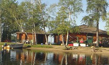 Guest cabins viewed from lake at Pakashkan Lake Lodge