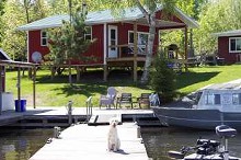 Boat dock and cabin at Rex Tolton's Miles Bay Camp