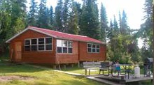 Guest cabin with grill and chairs at Shabu Wilderness Outposts