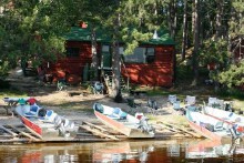 Tang of the North Lodge lakefront cabin with boats
