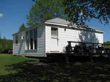 Housekeeping cabin at White Birches Cottages & Camping