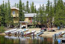 Main lodge and boats at Beaver Lodge Fly-Inn