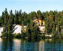 Lakefront cabin on rock at Boreal Camp Services & Outfitting, Ltd.